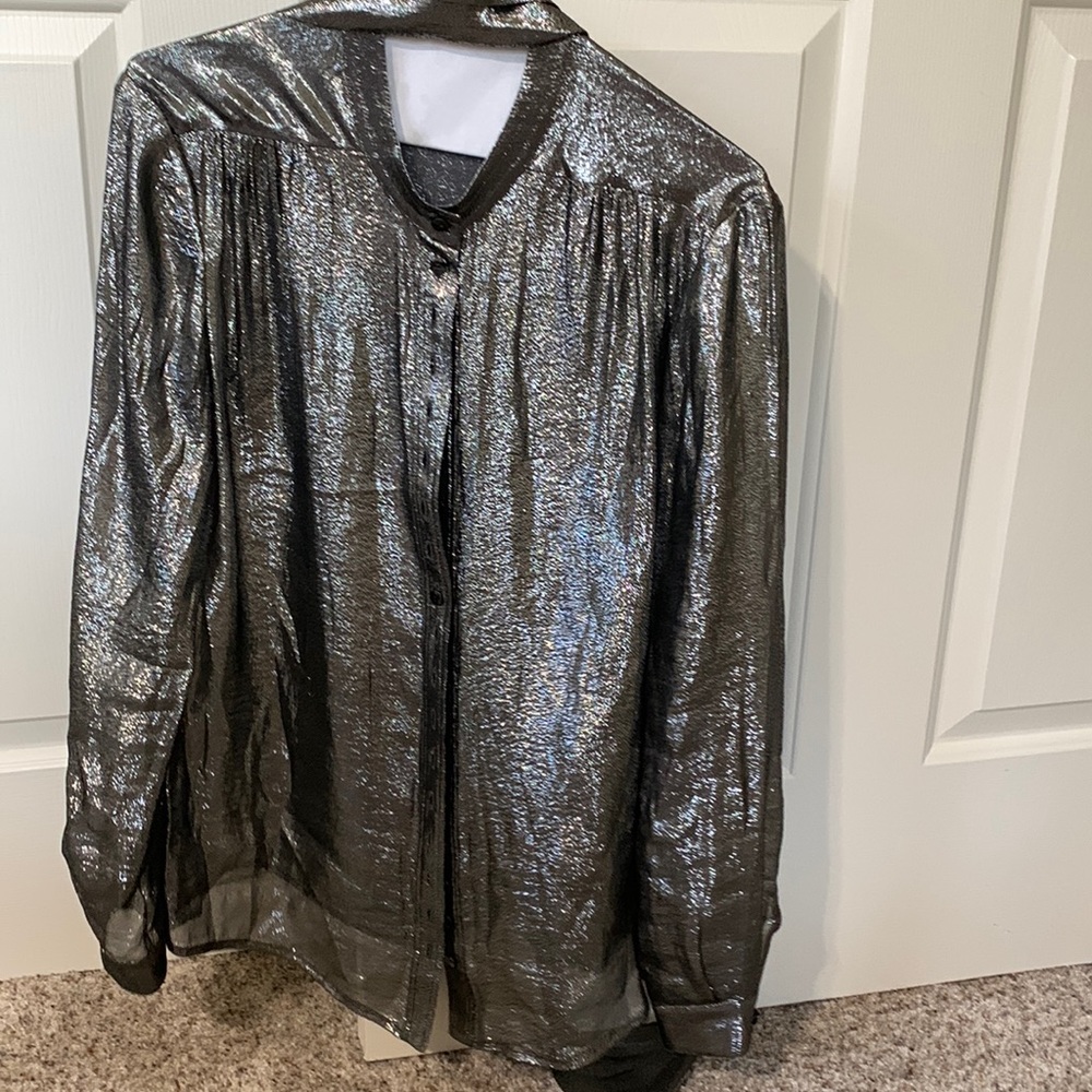 Women’s silk and polyester blouse silver in color.